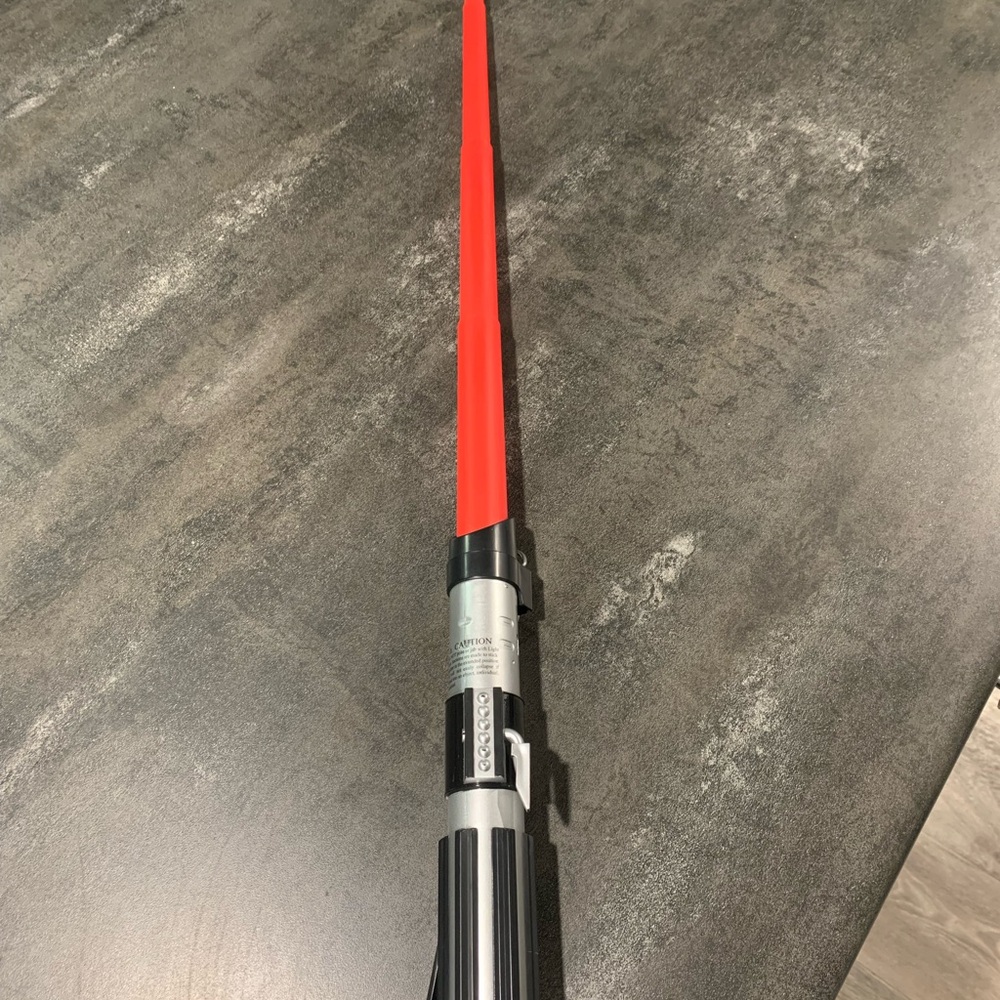 Hasbro Red and Silver Toy Lightsaber